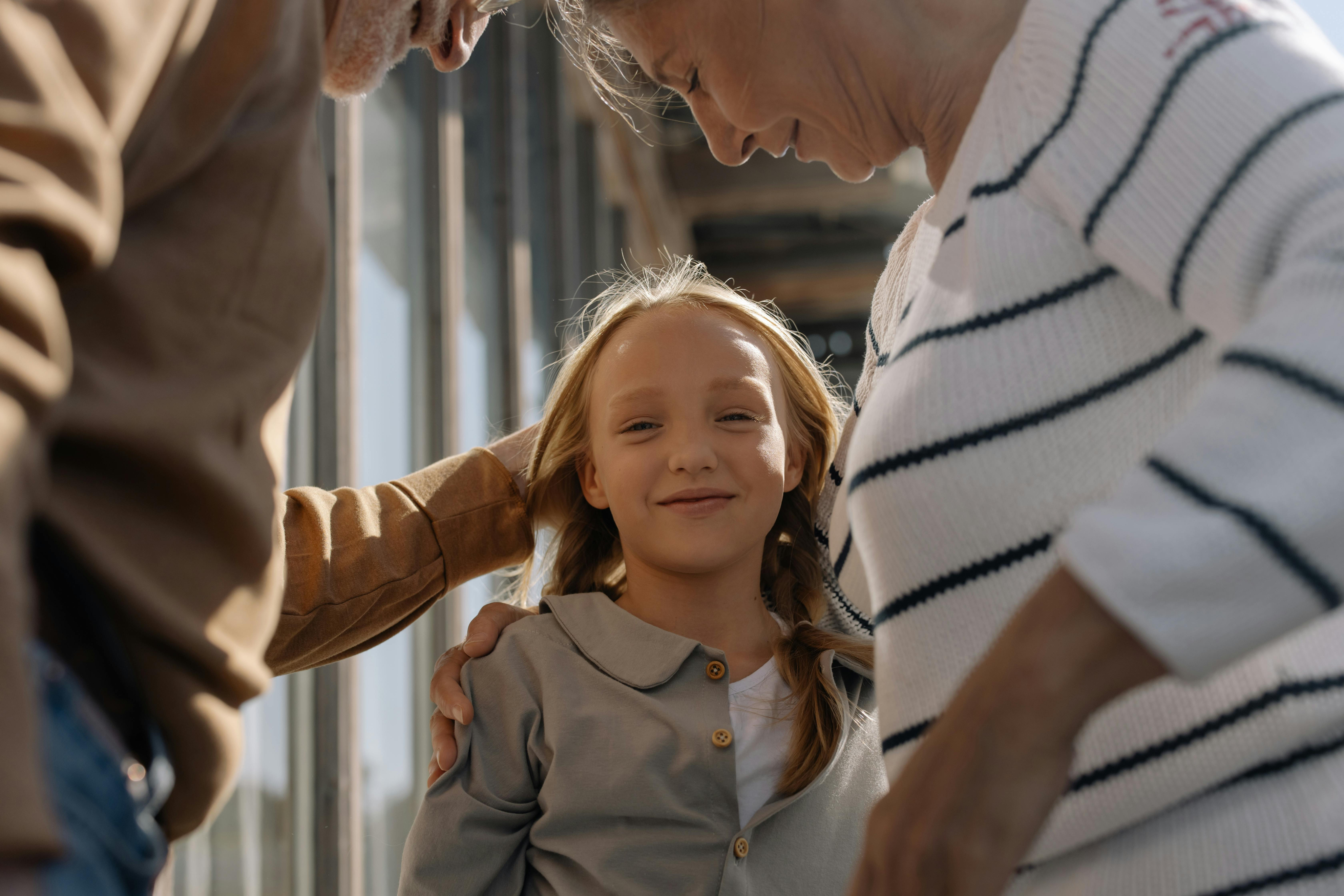 girl with grandparents
